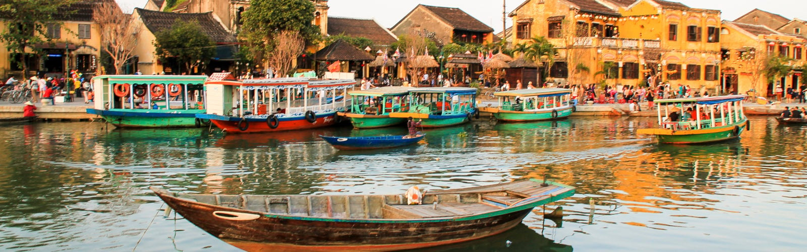 River view over Hoi An with traditional boats in Vietnam