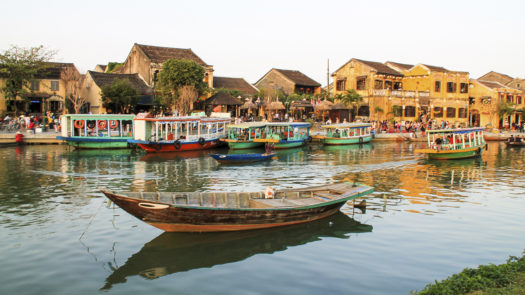 River view over Hoi An with traditional boats in Vietnam