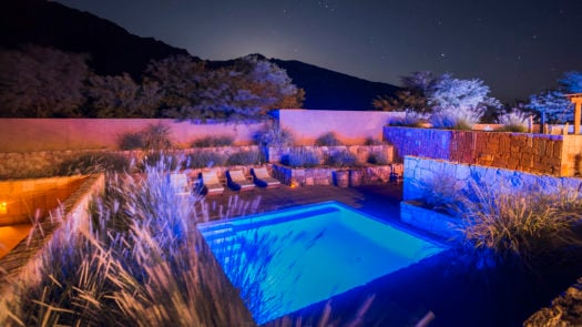 Outdoor swimming pool at night at Hotel Alto Atacama Desert Lodge and Spa, San Pedro de Atacama, Atacama Desert, Chile