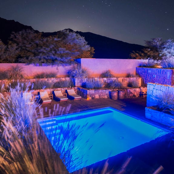 Outdoor swimming pool at night at Hotel Alto Atacama Desert Lodge and Spa, San Pedro de Atacama, Atacama Desert, Chile