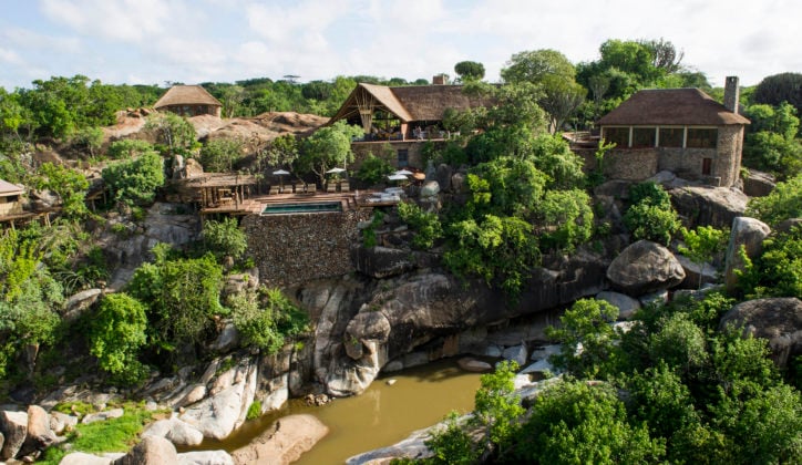 View of Legendary Mwiba Lodge set upon the rocks among the trees above the river, Mwiba Wildlife Reserve Tanzania