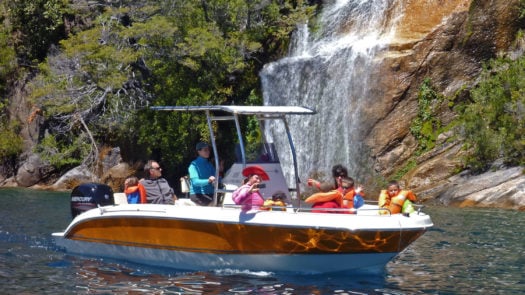 Boating past hidden waterfalls, Lake District, Argentina
