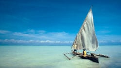 Dhow in the crystal turquoise waters of Zanzibar, Tanzania