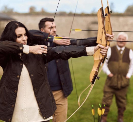 A couple learns archery at Adare Manor in Limerick