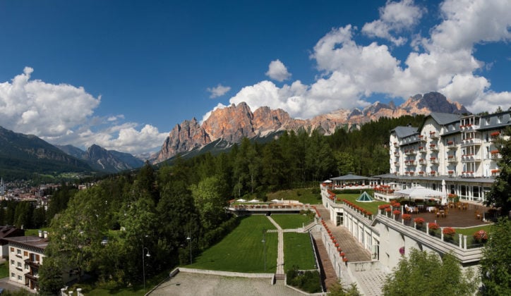 Gardens of The Cristallo set against the rugged peaks, Cortina d'Ampezzo Italy