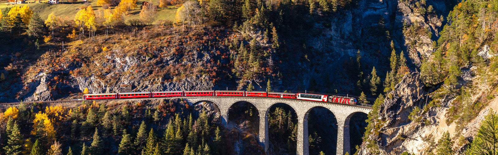 The Gornergrad train running over the Landvasser Viaduct in the Swiss mountains