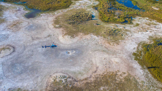 vast open spaces of Botswana with helicopter