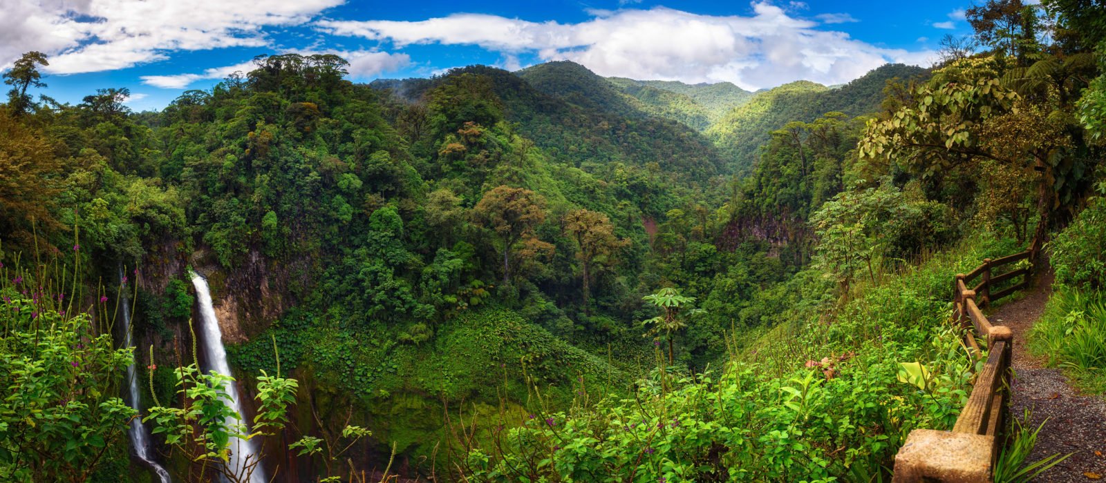 Panorama of the Catarata del Toro waterfall in Costa Rica with surrounding mountains