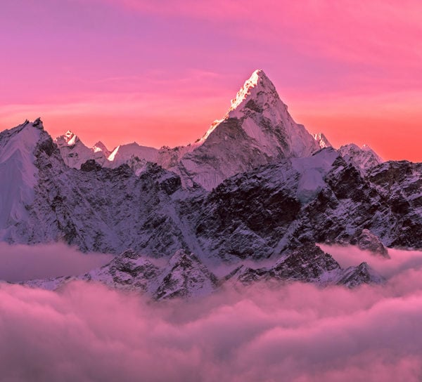 Majestic Ama Dablam peak (6856m) in the red and pink hues of sunrise - Nepal, Himalayas