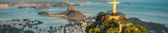 Panoramic of Christ the Redeemer, Rio de Janeiro, at golden hour set against the city and Guanabara Bay