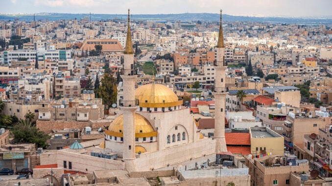 Madaba, Jordan, view of the central and largest mosque with high minarets in the ancient city of the Middle East.