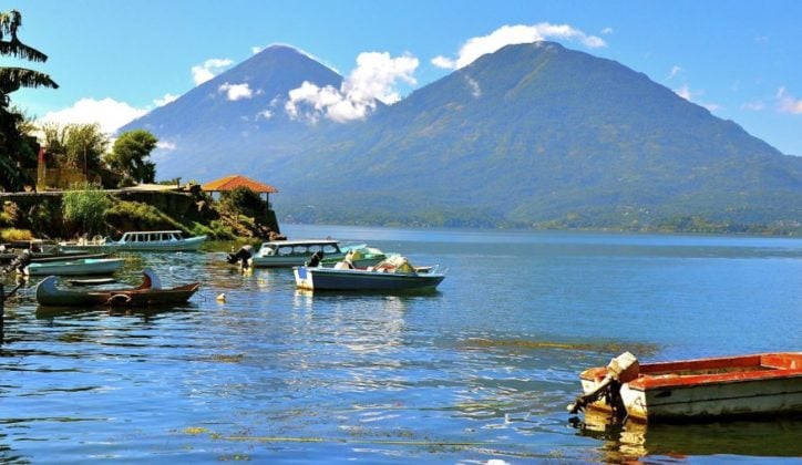 Boats moored on Lake Atitlan in Guatemala against a mountainous backdrop